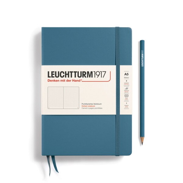 Stone blue hardcover dotted notebook with closure strap and two bookmarks.